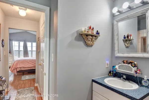 a bathroom with a sink and a mirror