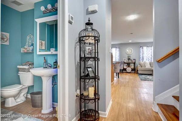 a bathroom with a sink toilet and mirror