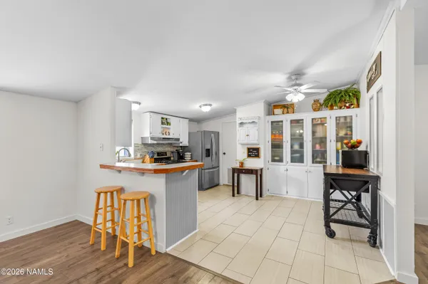 a kitchen with stainless steel appliances granite countertop a sink and cabinets