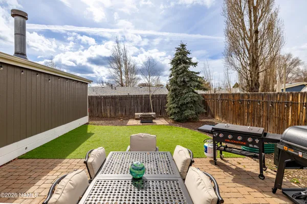 a view of a backyard with furniture