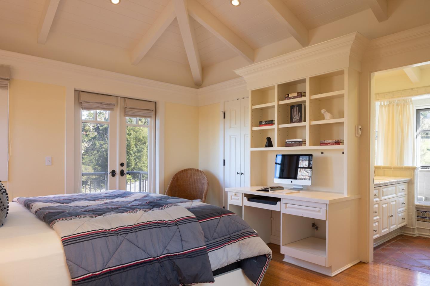 72 Fern Canyon Road Carmel, CA 93923 - Photo 34 of 66 a bedroom with a bed and a desk