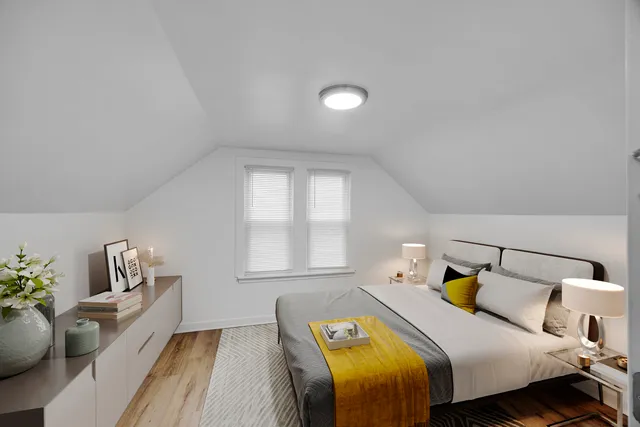 a bed room with bed and window