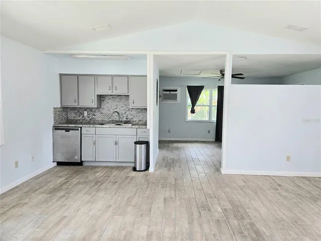 a kitchen with a sink and cabinets