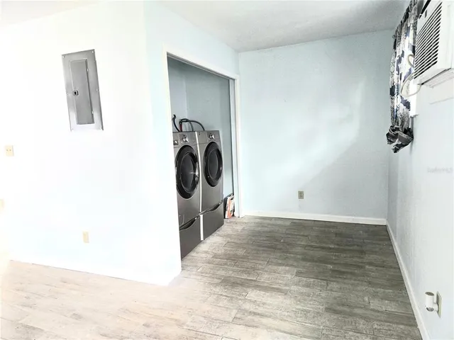 a view of a storage & utility room with a washer dryer