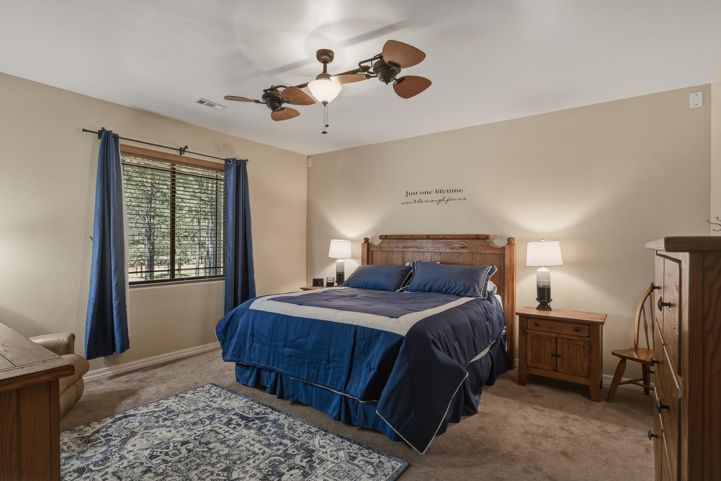 1233 Merzville Road Forest Lakes, AZ 85931 - Photo 15 of 39 a bedroom with a bed and a window