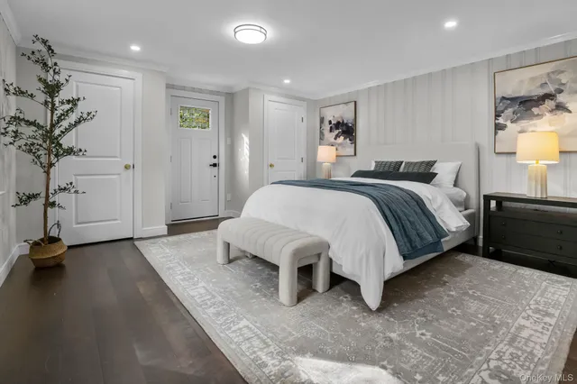 a spacious bedroom with a bed and a couch