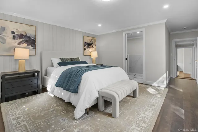 a spacious bedroom with a bed and a couch