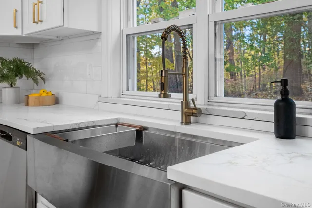 a kitchen with a sink and a window