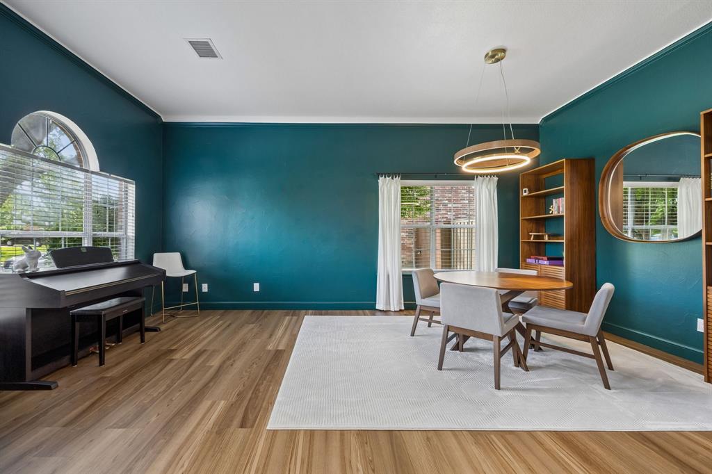 9217 Inverness Drive Rowlett, TX 75089 - Photo 5 of 40 Flexible Front Living and Dining Area — This spacious tandem room offers room to dine, relax, create, or entertain, with tall ceilings, natural light, and a strong sense of arrival near the foyer.