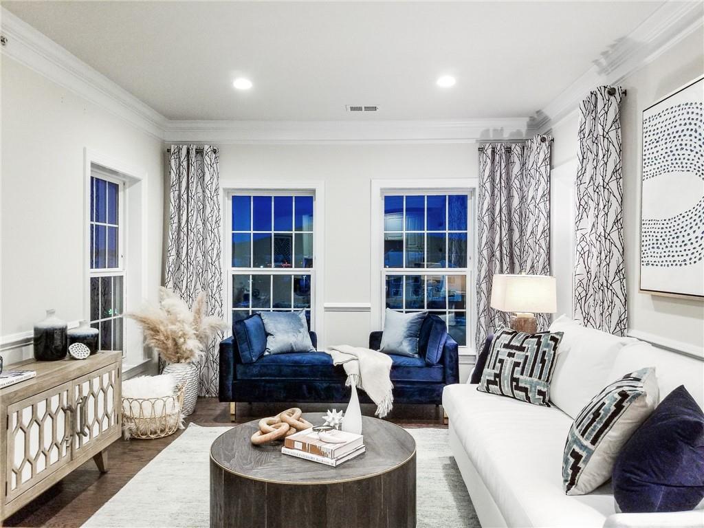 a living room with furniture and a table
