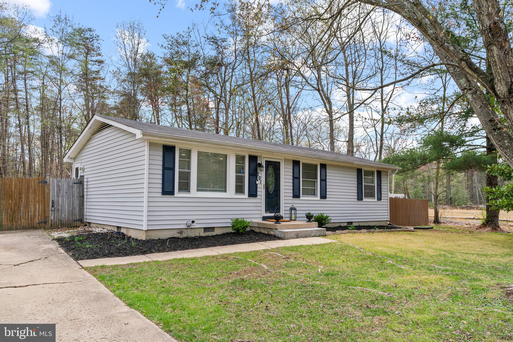 701 Eucla Drive Waldorf, MD 20601 - Photo 2 of 23 a front view of house with yard and trees in the background