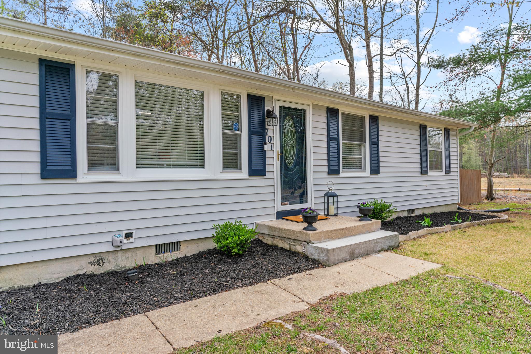 701 Eucla Drive Waldorf, MD 20601 - Photo 4 of 23 a front view of a house with garden and patio
