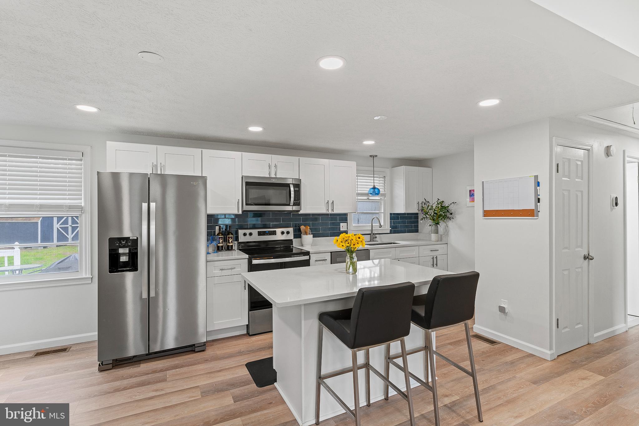701 Eucla Drive Waldorf, MD 20601 - Photo 9 of 23 a kitchen with stainless steel appliances a refrigerator and a stove top oven
