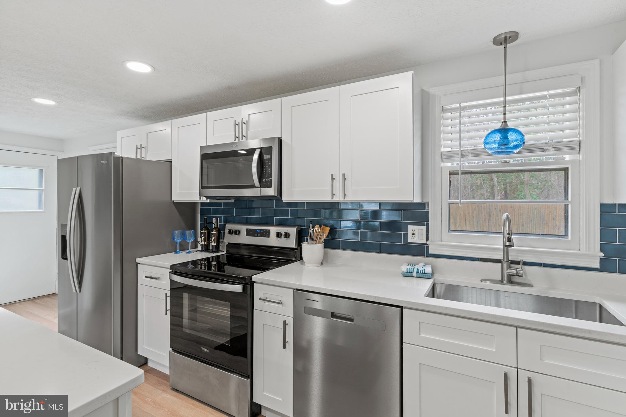 701 Eucla Drive Waldorf, MD 20601 - Photo 10 of 23 a kitchen that has a sink and a stove top oven