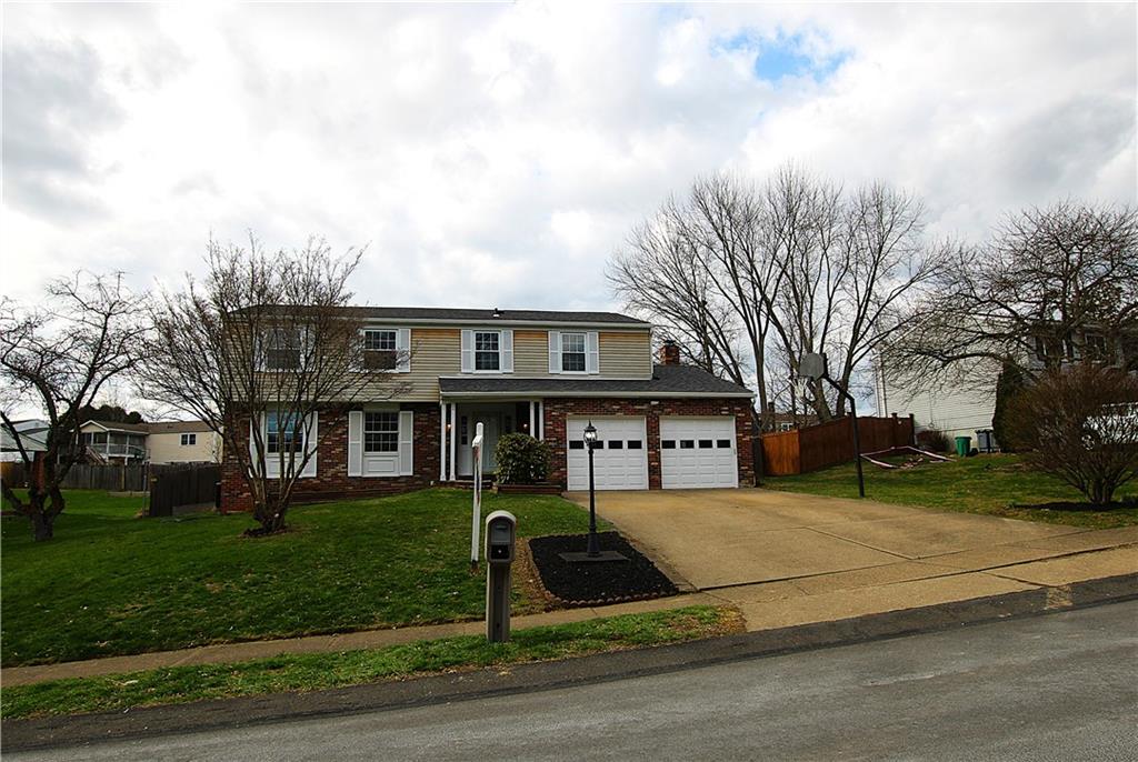 855 2nd Avenue Freedom, PA 15042 - Photo 1 of 42 a view of a white house next to a yard with big trees