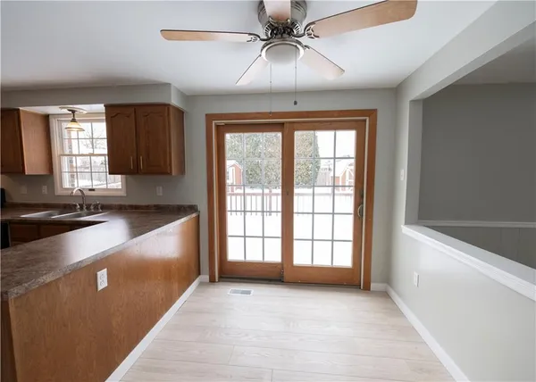 a view of a kitchen with a sink and a window