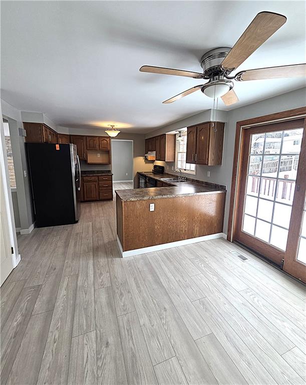 855 2nd Avenue Freedom, PA 15042 - Photo 15 of 42 a view of a livingroom with furniture hardwood floor and a ceiling fan