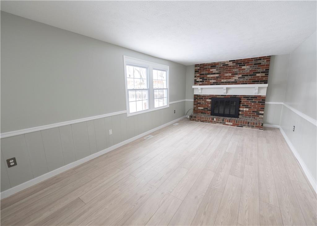855 2nd Avenue Freedom, PA 15042 - Photo 17 of 42 wooden floor in an empty room with a window