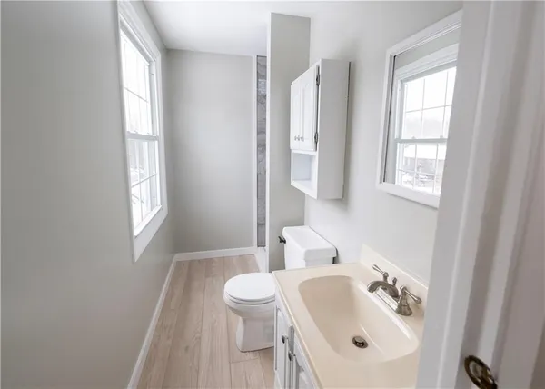 a bathroom with a sink a toilet and tub