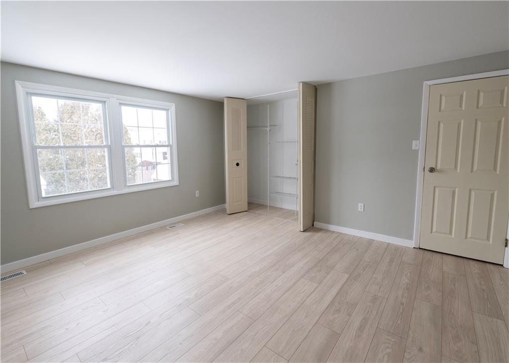 855 2nd Avenue Freedom, PA 15042 - Photo 29 of 42 an empty room with wooden floor and windows