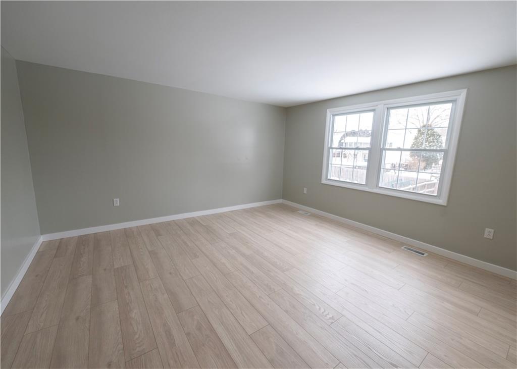 855 2nd Avenue Freedom, PA 15042 - Photo 30 of 42 an empty room with wooden floor and windows