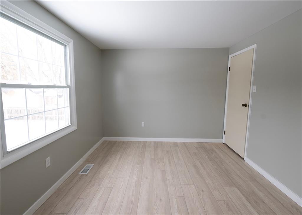 855 2nd Avenue Freedom, PA 15042 - Photo 31 of 42 an empty room with wooden floor and windows
