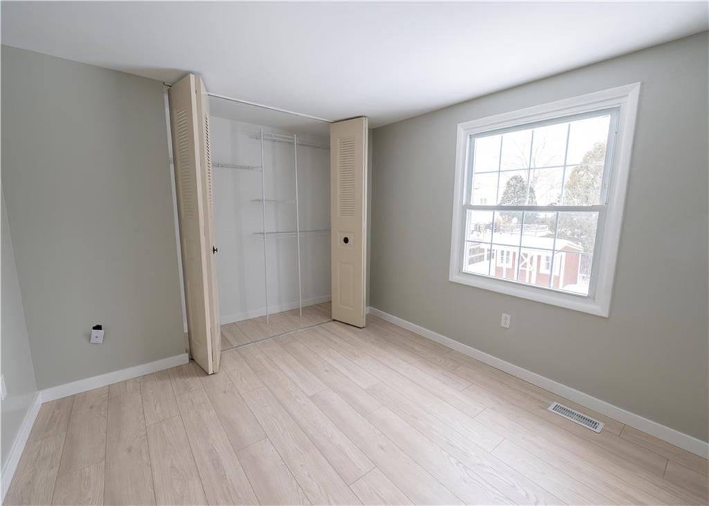 855 2nd Avenue Freedom, PA 15042 - Photo 32 of 42 a view of an empty room with wooden floor and a window