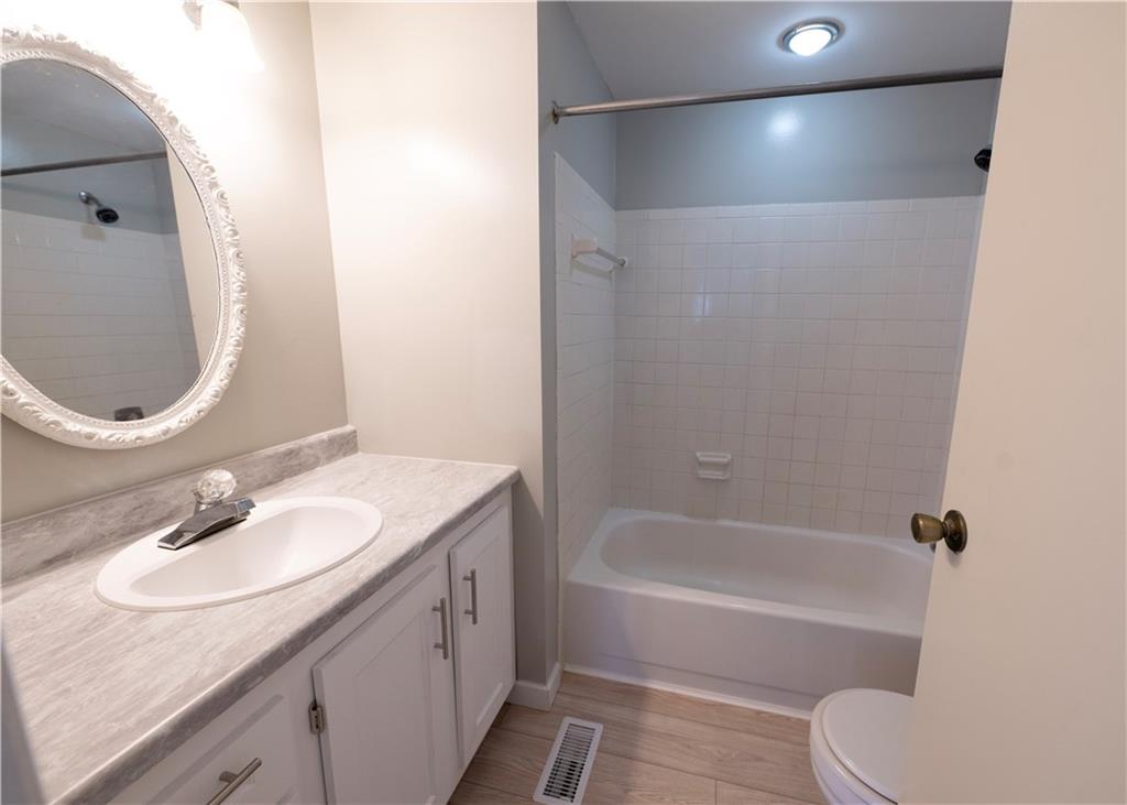 855 2nd Avenue Freedom, PA 15042 - Photo 33 of 42 a bathroom with a granite countertop sink toilet and shower