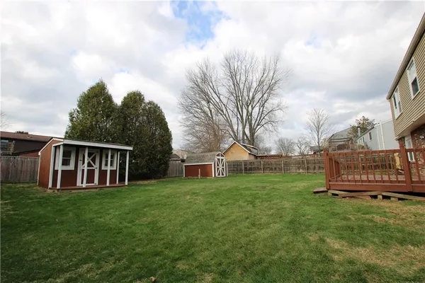 a view of a house with a backyard