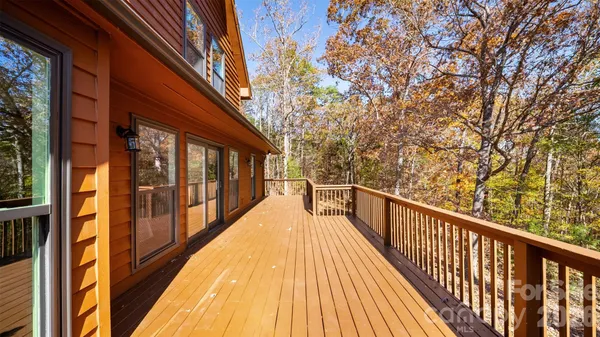 a view of balcony with wooden floor