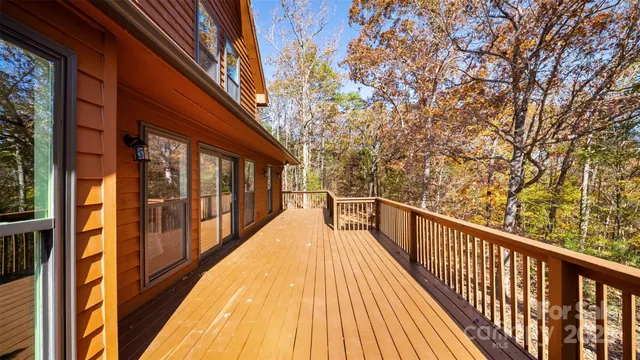 a view of balcony with wooden floor