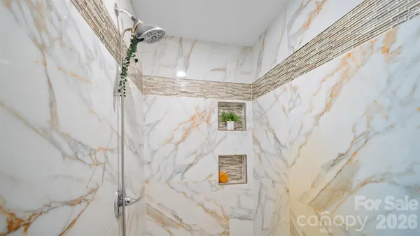 a bathroom with a sink and shower curtain