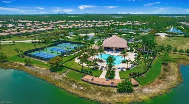 an aerial view of a house with a garden and trees