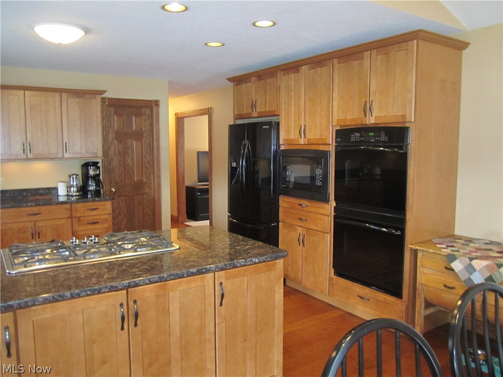 4834 Camp Road Rootstown, OH 44272 - Photo 10 of 22 Maple, granite, can lights, hardwood floor, double oven, counter top gas range.