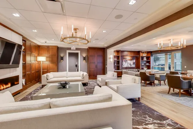 a living room with fireplace furniture and a flat screen tv