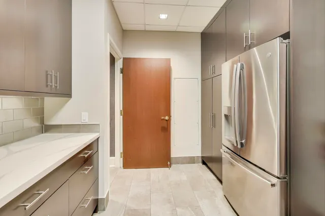 a kitchen with a refrigerator and countertop