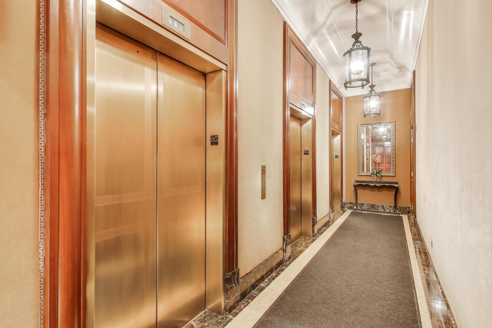 57 East Delaware Place, Unit 3504 Chicago, IL 60611 - Photo 5 of 45 a view of a hallway with wooden floor