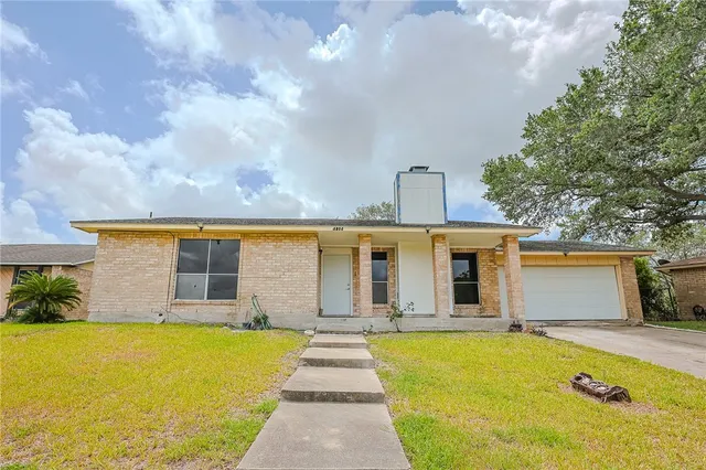 a front view of a house with swimming pool