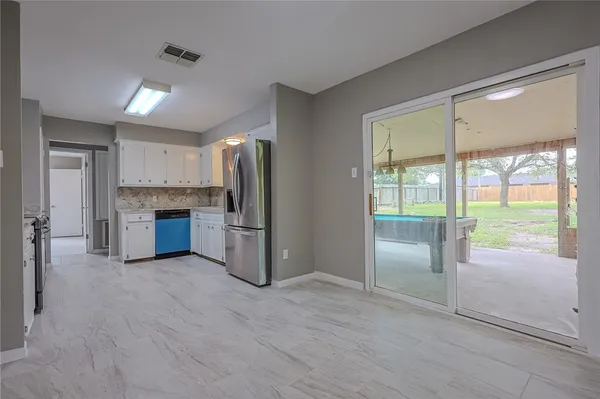 a kitchen with stainless steel appliances a refrigerator and a sink