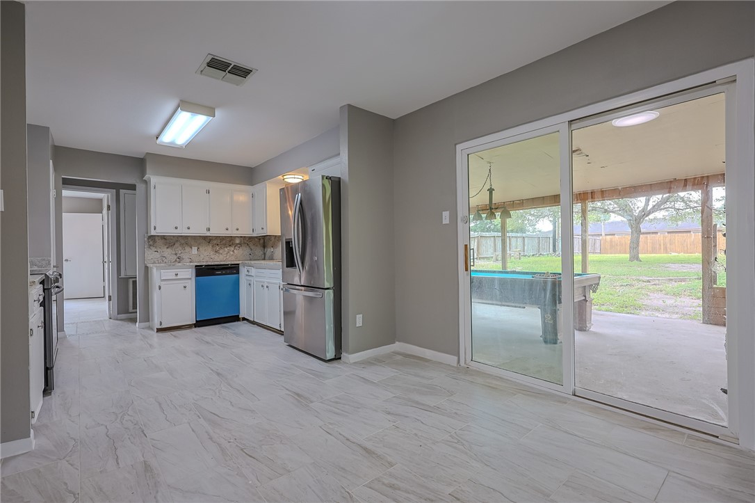 4314 Caplin Drive Corpus Christi, TX 78410 - Photo 11 of 25 a kitchen with stainless steel appliances a refrigerator and a sink