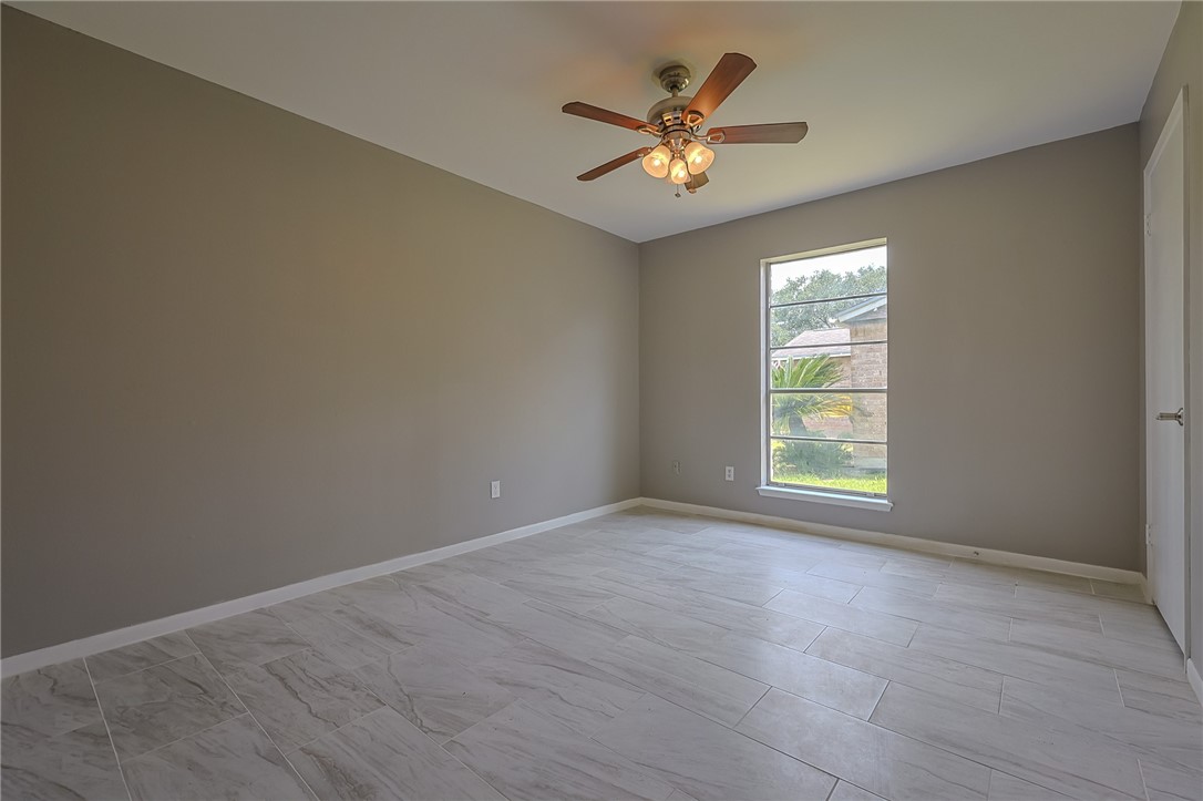 4314 Caplin Drive Corpus Christi, TX 78410 - Photo 13 of 25 a view of an empty room with a window