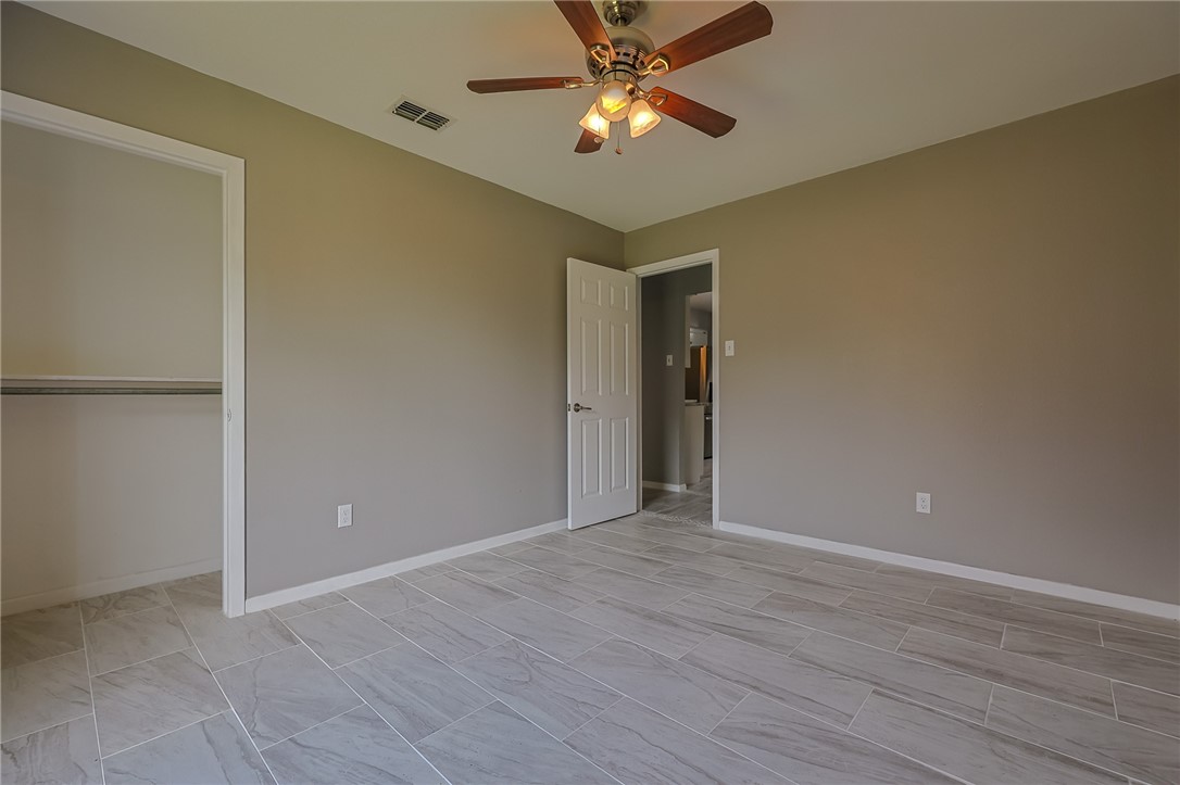 4314 Caplin Drive Corpus Christi, TX 78410 - Photo 14 of 25 a view of an empty room and chandelier fan