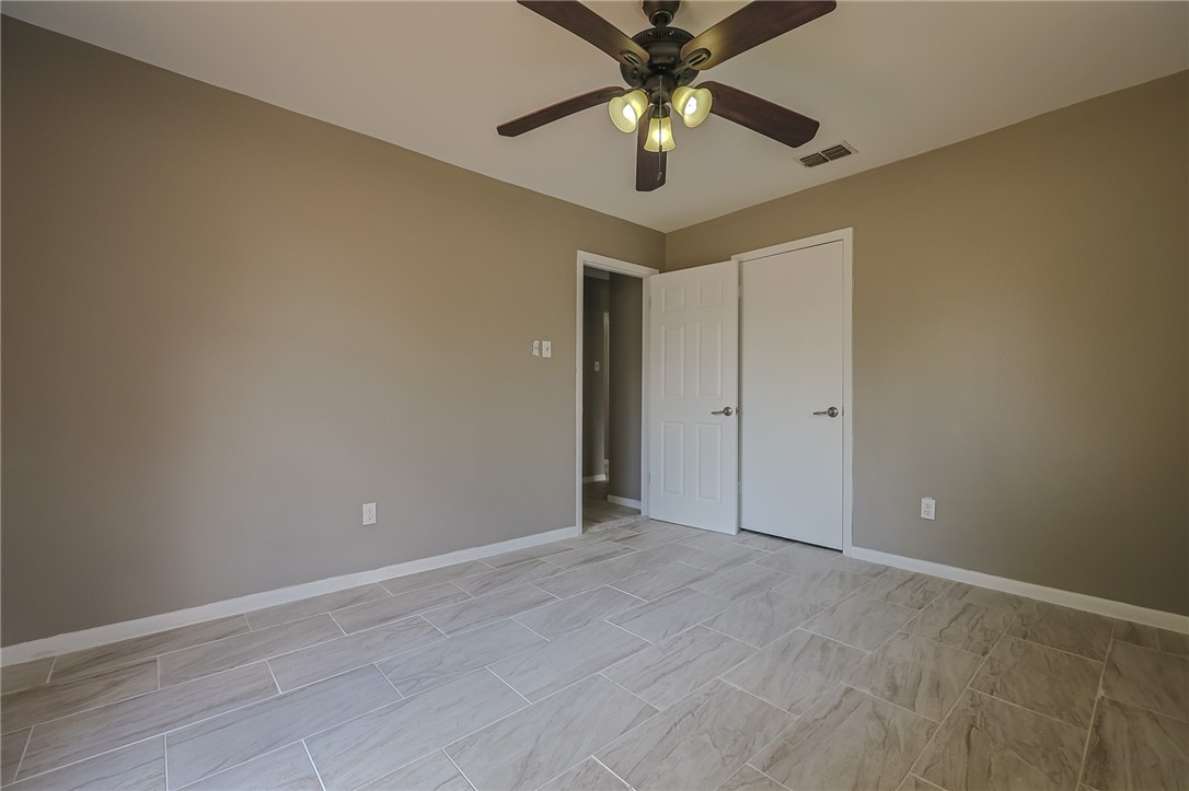 4314 Caplin Drive Corpus Christi, TX 78410 - Photo 16 of 25 an empty room and chandelier fan
