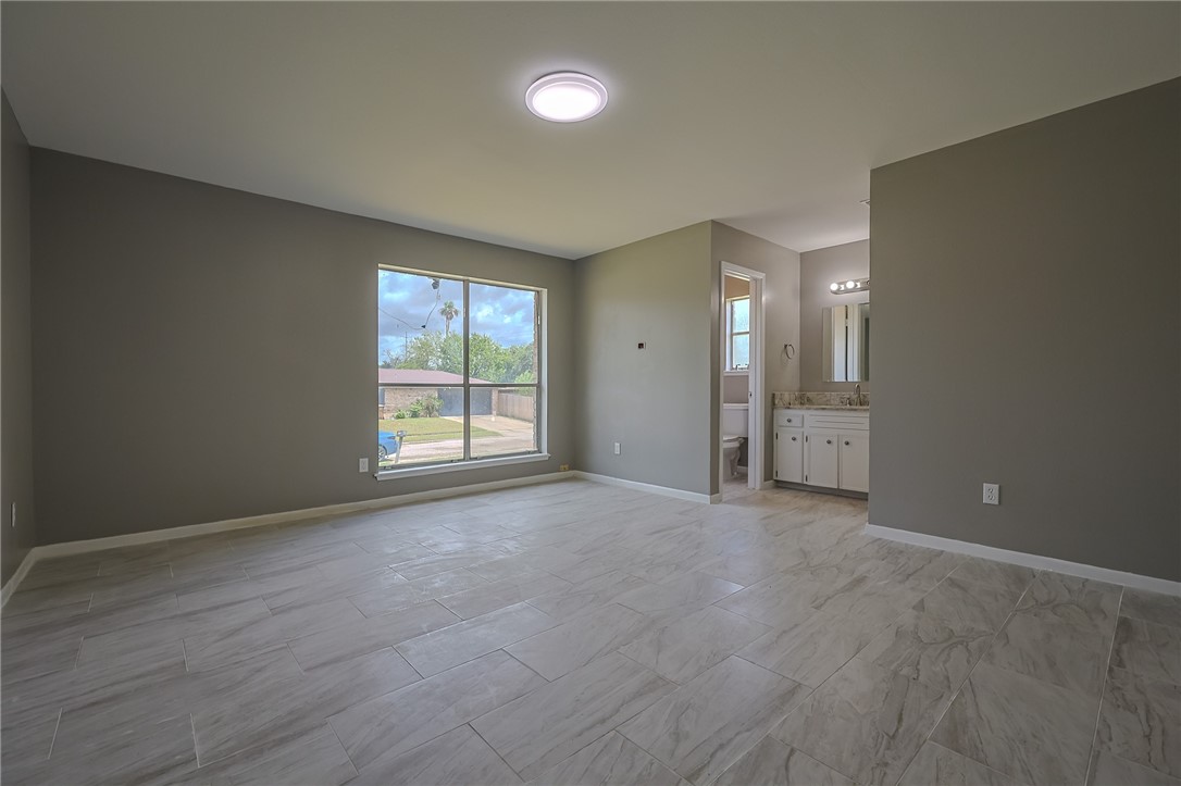 4314 Caplin Drive Corpus Christi, TX 78410 - Photo 18 of 25 a view of an empty room with a window