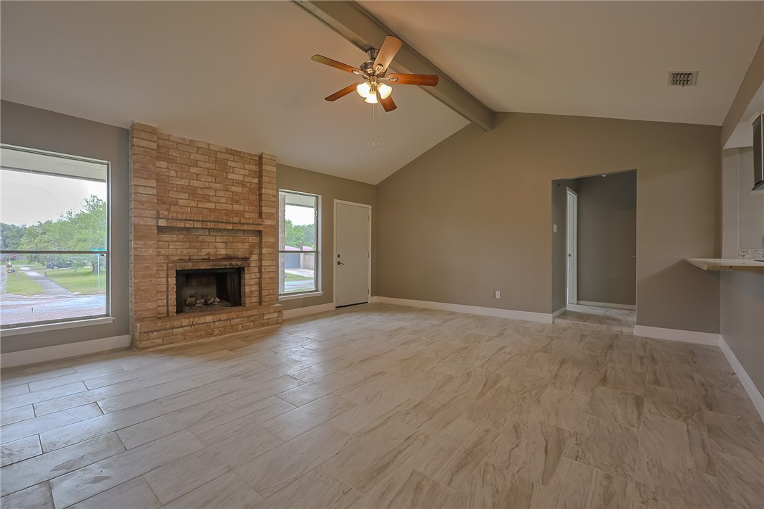 4314 Caplin Drive Corpus Christi, TX 78410 - Photo 3 of 25 a view of empty room with fireplace and wooden floor