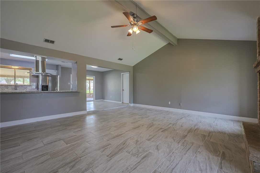 4314 Caplin Drive Corpus Christi, TX 78410 - Photo 5 of 25 a view of an empty room with window and wooden floor