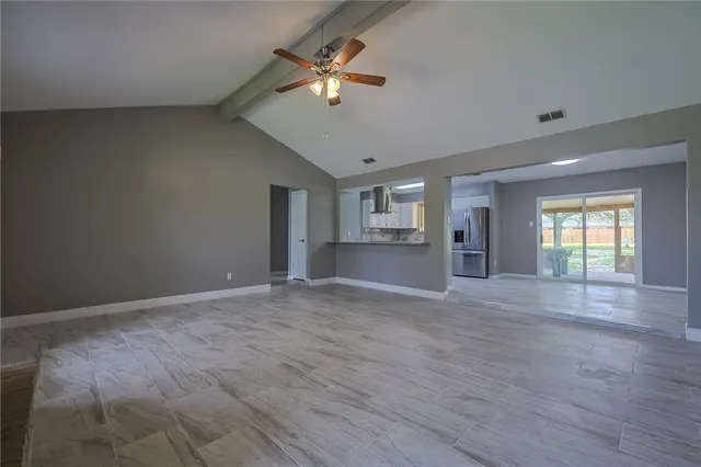 a view of an empty room with a window