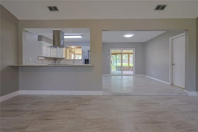 a view of an empty room and window