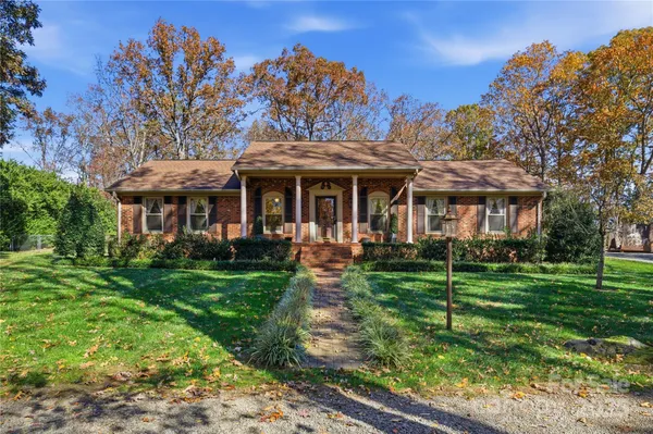 a view of a house with backyard porch and garden