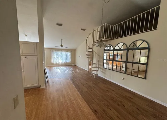 a view of front door with wooden floor